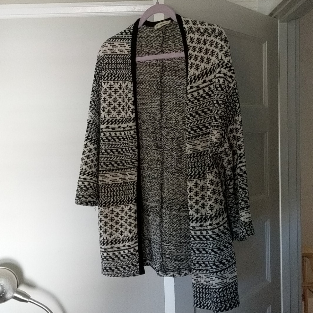 Black and cream patterned sweater